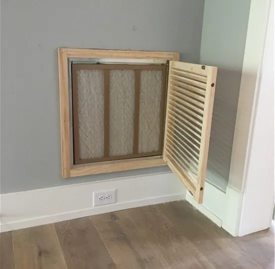A room with a window and wooden frame