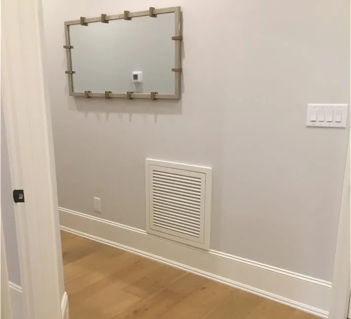 A mirror and some lights in a room.
